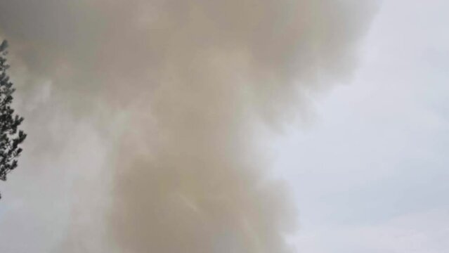 Thick Smoke Rising From Bonfire In Daytime. Air Pollution. tilt-up