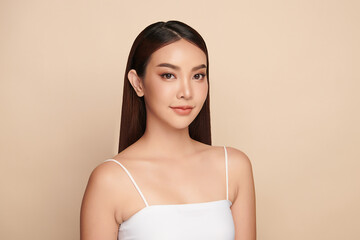 Beautiful young asian woman with clean fresh skin on beige background, Face care, Facial treatment, Cosmetology, beauty and spa, Asian women portrait.