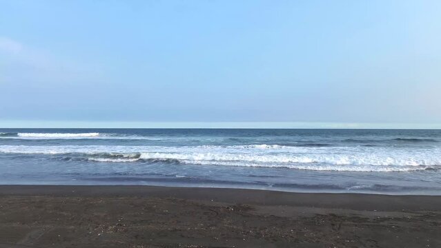 Man alone in beach. Drone shot of man in the beach