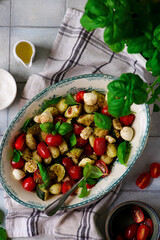 Italian Caprese salad with gnocchi and vegetables.. .style rustic