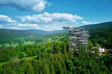 Fotobehang Helix Bridge Sky Walk observation tower in Sweradow Zdroj, Poland. Tourist attraction in montains, aerial view. Panoramic view of nature landscape with green forest