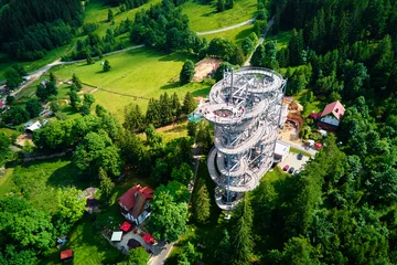 Papier Peint photo autocollant Helix Bridge Sky Walk observation tower in Sweradow Zdroj, Poland. Tourist attraction in montains, aerial view. Panoramic view of nature landscape with green forest