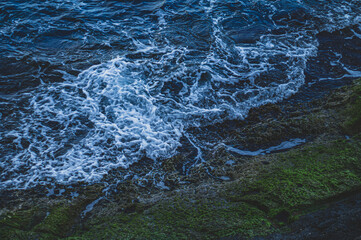 water surface on a rocky beach