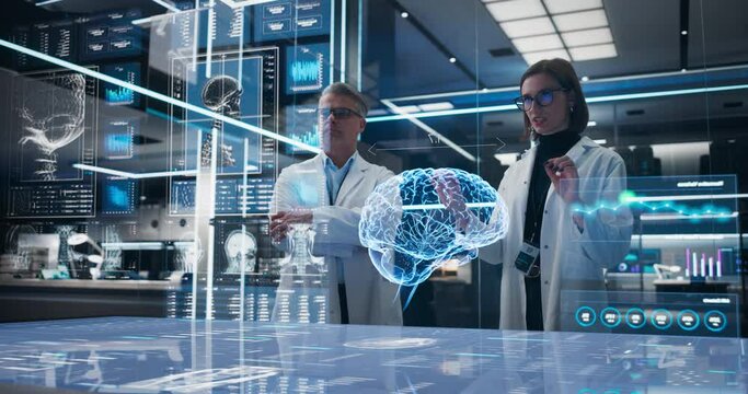 Two Neuroscientists Working With Computer-Powered Animated VFX Hologram Of Human Brain And Nervous System In Futuristic Laboratory. Caucasian Man And Woman Working On Solutions for Brain Damage.