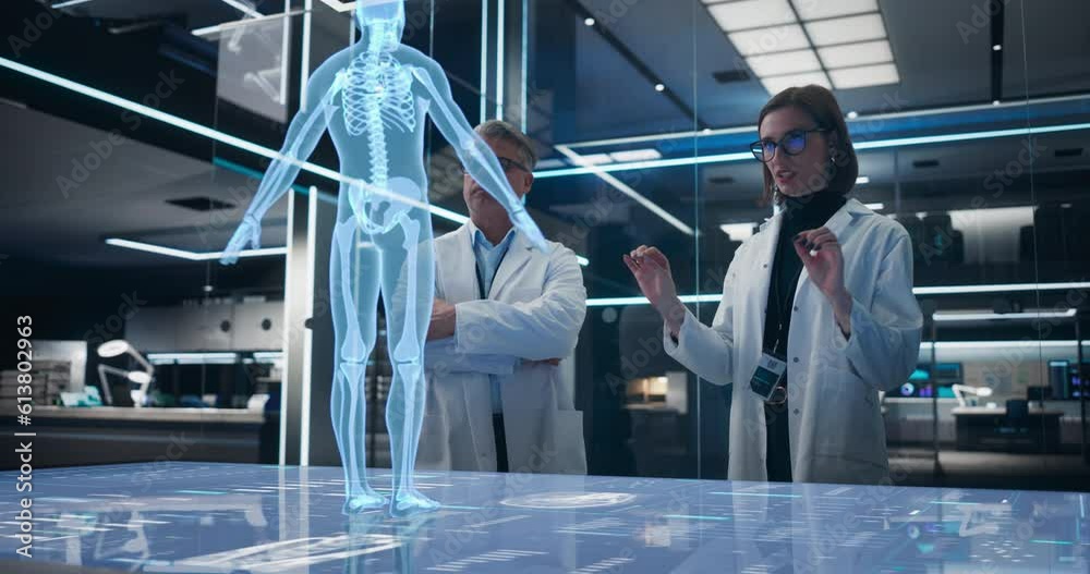 Poster Two Bioengineers Working With Computer-Powered Animated VFX Hologram Of Human Body And Organs In Futuristic Lab. Man And Woman Researching Blood Flow, Developing Innovative Healthcare Solutions.