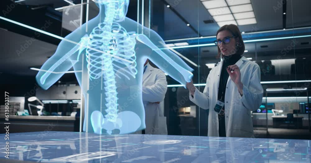 Poster Two Bioengineers Working With Computer-Powered Animated VFX Hologram Of Human Chest With Heart And Blood Flow In Futuristic Lab. Caucasian Man And Woman Working On Innovative Heart Attack Prevention.