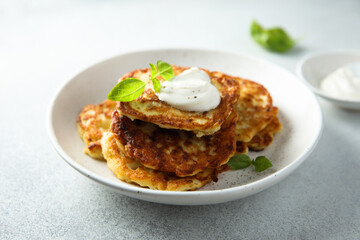 Traditional homemade latkes with sour cream