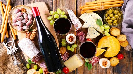 composition with red wine,  cheese selection and snacks