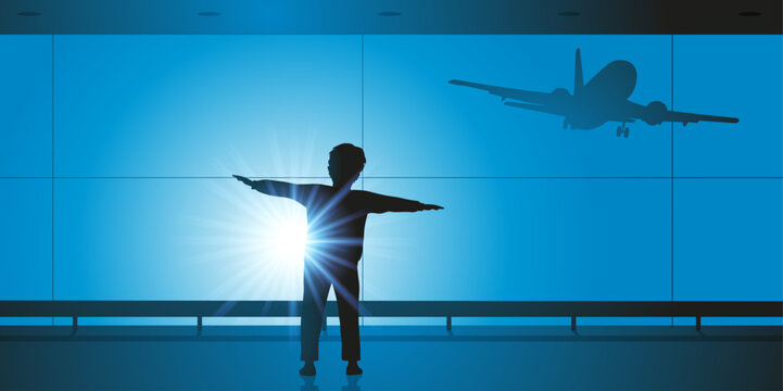 Concept du rêve d’enfant avec un jeune garçon qui s’imagine devenir pilote en mimant le vol d’un avion.
