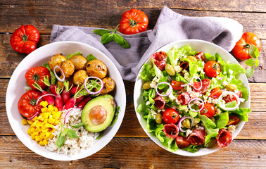 different sort of vegetable salad- vegetarian salad and salad with salami