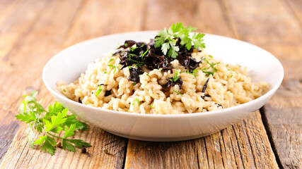 bowl of risotto with mushroom and herbs