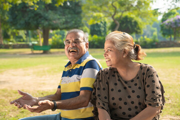 Happy senior couple spending time together at park.