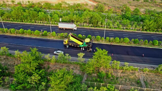 road restoration work  and vehicles going at hyderabad outer ring road express highway drone shot 4k 30p