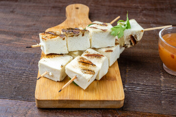 Grilled cheese skewers on skewers, large platen.