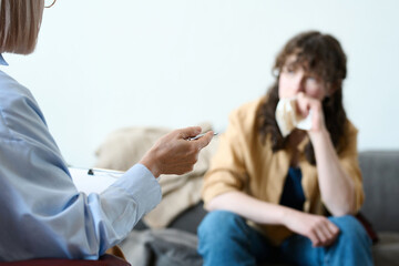 Psychologist giving an advice to patient during psycho consultation in office