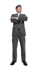Businessman in suit posing on white background, low angle view