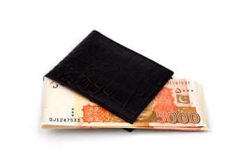Currency notes in Pakistani Rupees and a wallet.