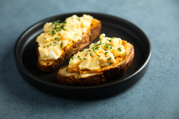 Homemade scrambled eggs on toast