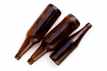 Empty brown bottles on white background.