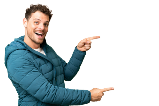 Brazilian man over isolated chroma key background pointing finger to the side and presenting a product