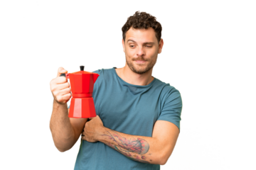 Brazilian man holding coffee pot over isolated chroma key background with sad expression
