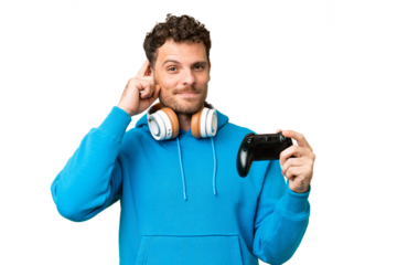 Brazilian man playing with a video game controller over isolated chroma key background having doubts