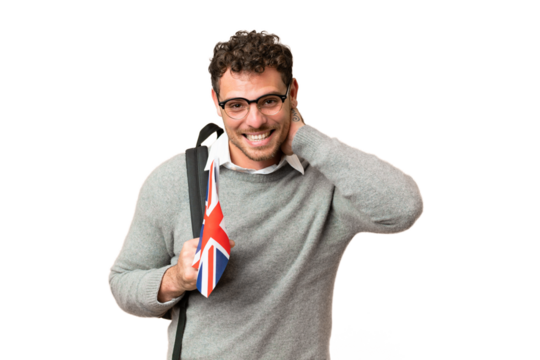 Brazilian man holding an United Kingdom flag over isolated chroma key background laughing