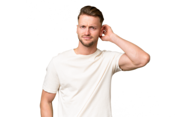 Young blonde caucasian man over isolated background having doubts