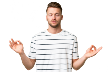 Young blonde caucasian man over isolated background in zen pose