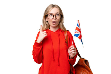 Young hispanic woman holding an United Kingdom flag over isolated background