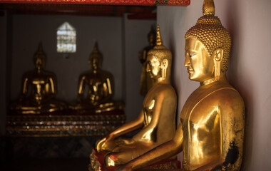 Buddha statues at Wat Po (Wat Pho), Temple of Reclining Buddha popular tourist attraction in Bangkok , Thailand