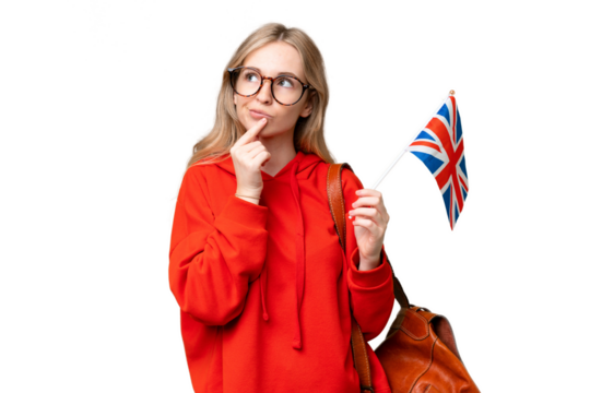 Young hispanic woman holding an United Kingdom flag over isolated background having doubts