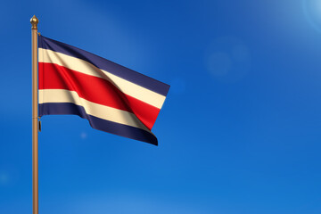 Costa Rica. Flag blown by the wind with blue sky in the background