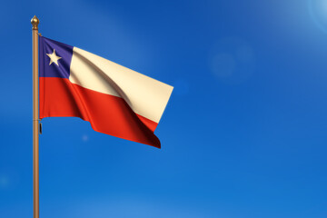 Chile. Flag blown by the wind with blue sky in the background