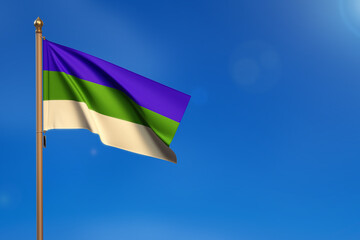 Komi. Flag blown by the wind with blue sky in the background
