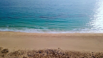 aerial view of a beautiful sandy beach by the blue Atlantic Ocean near Tarifa, Cadiz, Andalusia, Spain