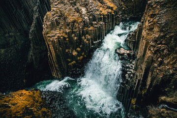 Fototapeta na wymiar A different perspective on famous Litlanesfoss waterfall near Hengifoss, in eastern Iceland.