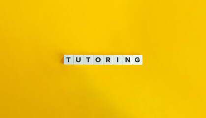 Tutoring Word on Letter Tiles on Yellow Background. Minimal Aesthetic.