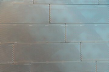 Metal Perforated Wall Tiles of contemporary building. Facade Wall. Construction, archetecture texture