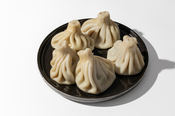  Plate with khinkali isolated on white background 