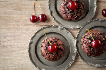 muffins with fresh cherry close up on the plate.