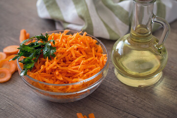 Salad with fresh carrot and oil.
