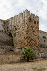 Stone wall fortifications in moat of old town of Rhodes, Greece