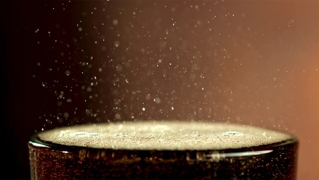 Cola drink in a glass with bubbles in the air. Filmed is slow motion 1000 fps. High quality FullHD footage