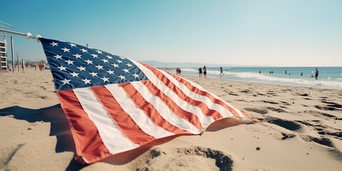 American flag detail waving at the beach near the ocean