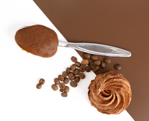 homemade marshmallow zephyr with coffee and caramel.natural ingredients.open book coffee cup.woman hand taking one piece.smiling face from coffee beans.dessert in box, or torn paper, diagonal lines