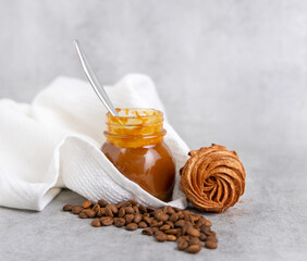 homemade marshmallow zephyr with coffee and caramel.natural ingredients.open book coffee cup.woman hand taking one piece.smiling face from coffee beans.dessert in box, or torn paper, diagonal lines