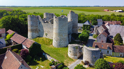 Aerial view of the medieval castle of Yèvre le Châtel in the French department of Loiret - Enclosure with 4 round towers at the top of a hill in a rural village