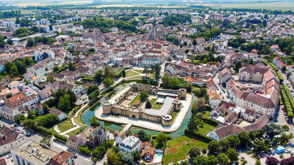 Aerial view of the square-based medieval castle of Brie Comte Robert surrounded with a water-filled...