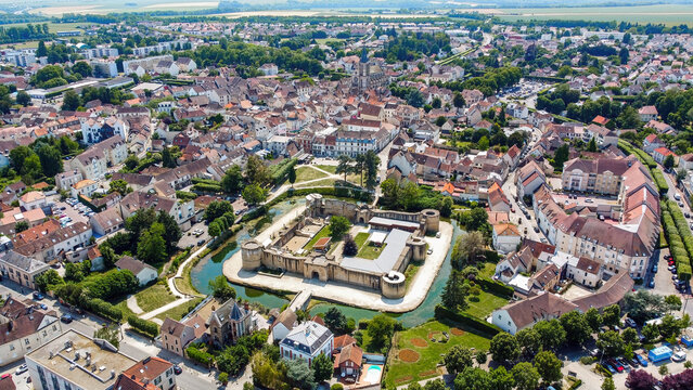Aerial view of the square-based medieval castle of Brie Comte Robert surrounded with a water-filled moat in the French department of Seine et Marne in the capital region of Ile-de-France near Paris
